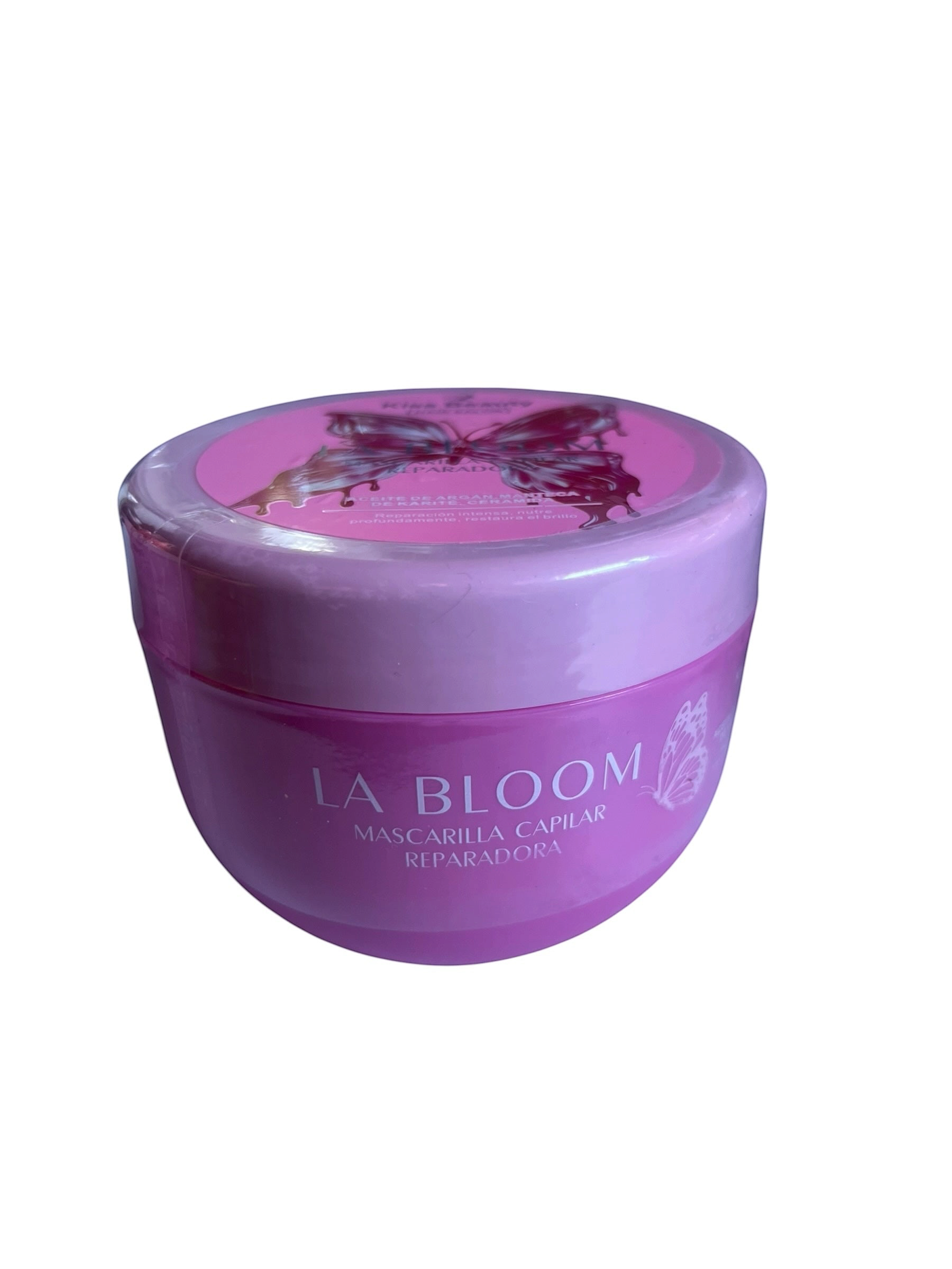 Mascarilla capilar reparadora La Bloom de Selsebil en envase redondo color rosa con diseño de mariposa